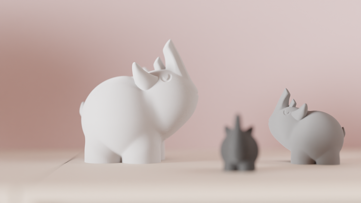 White and grey Cute Rhino Figures arranged together on a shelf