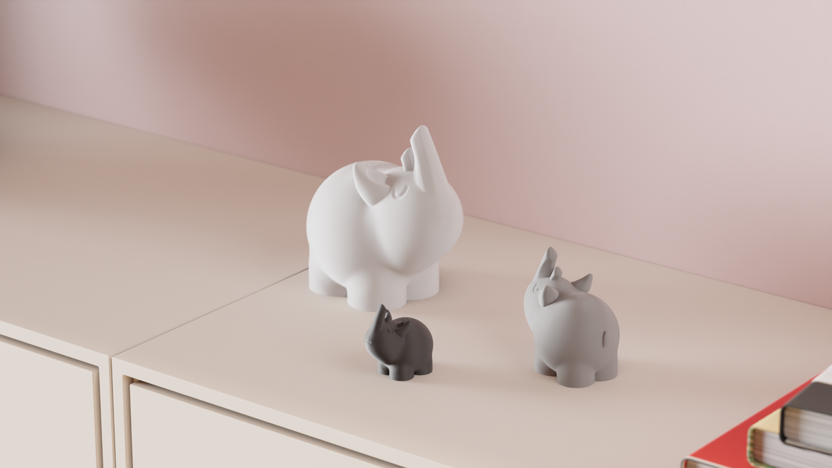 Cute Rhino Figures displayed on a white cabinet beside stacked books