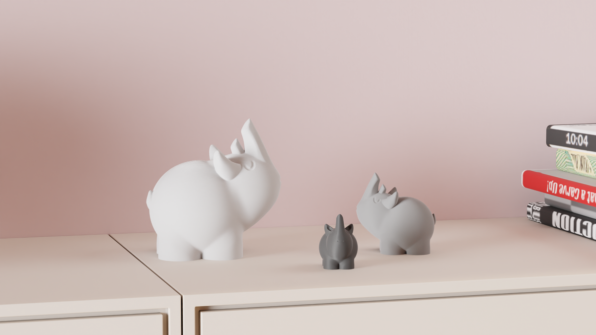 Cute Rhino Figures displayed on a shelf beside colourful books