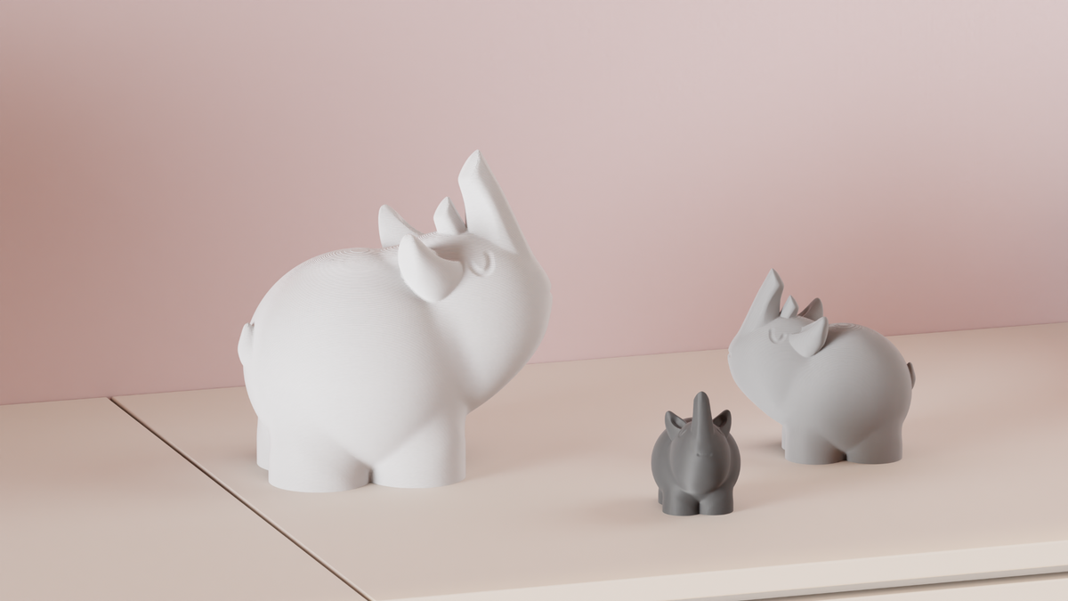Large and small Cute Rhino Figures arranged together on a shelf