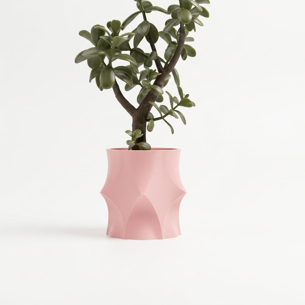 Modern Geometric Planter blush pink with jade plant on stacked travertine slabs minimal white background lifestyle