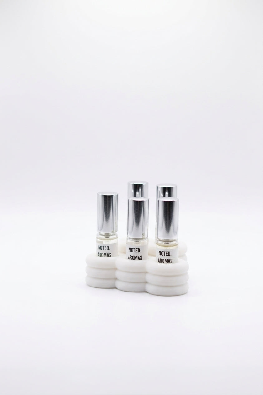 Cloud Perfume Sample Stand white with pastel geometric props pink sphere mint cube editorial