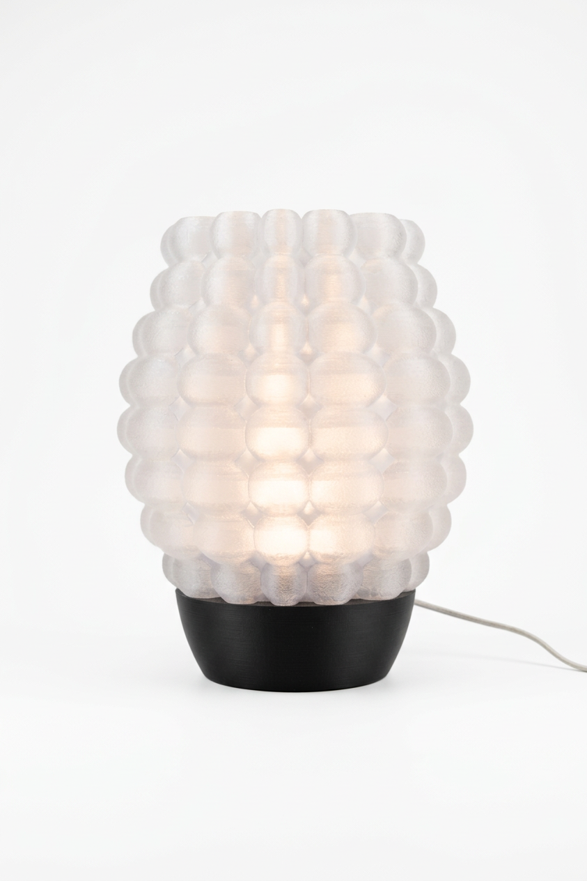 Bubble Glow Lamp pink glowing bubble texture shade black base travertine palm leaf vase lifestyle