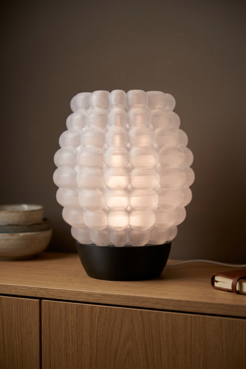 Bubble Glow Lamp white bubble texture shade black base dark slate monstera gold stem moody editorial