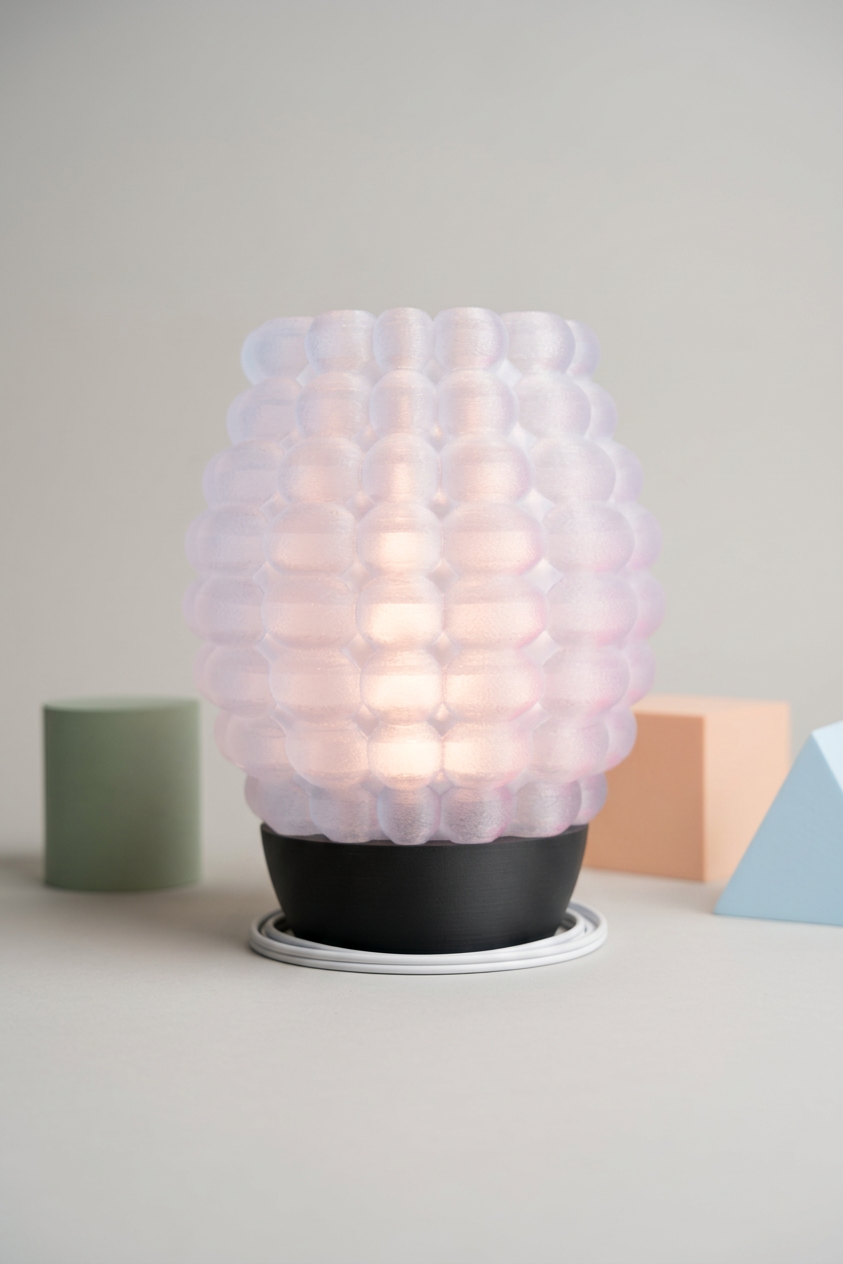 Bubble Glow Lamp white bubble texture shade black base travertine tile warm terracotta plaster olive branches golden hour
