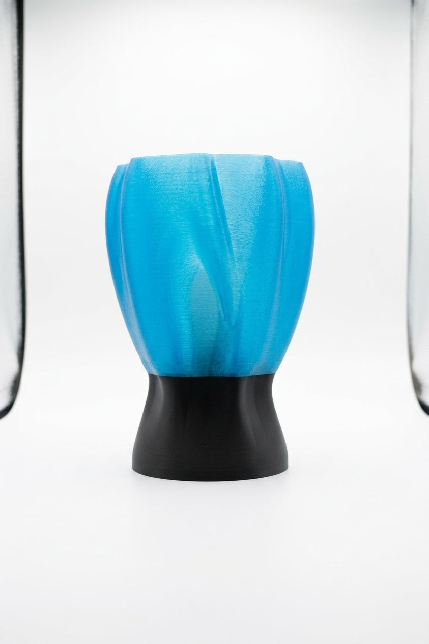 Draped organic flow lamp blue on bedside table warm evening light lifestyle