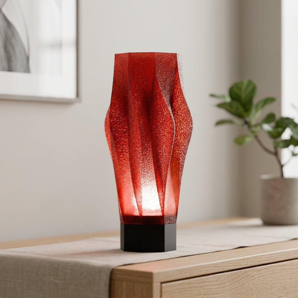 Sculptural Spiral Desk Lamp red shade black base with pastel cube props editorial product shot