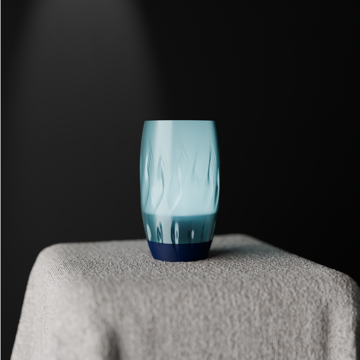 Twist Flame Vase tall barrel form organic wave flame dimple texture translucent ice blue upper body matte deep navy black base pale grey linen plinth dark studio background clean editorial hero shot