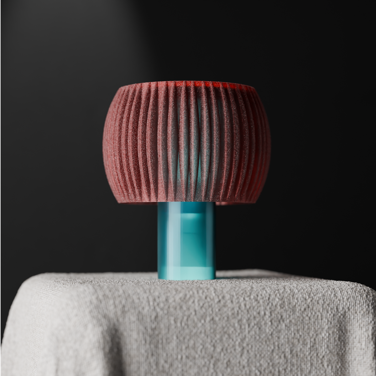 Elegant Funnel Glow Lamp pink shade teal base on linen draped plinth dark moody editorial angle 2