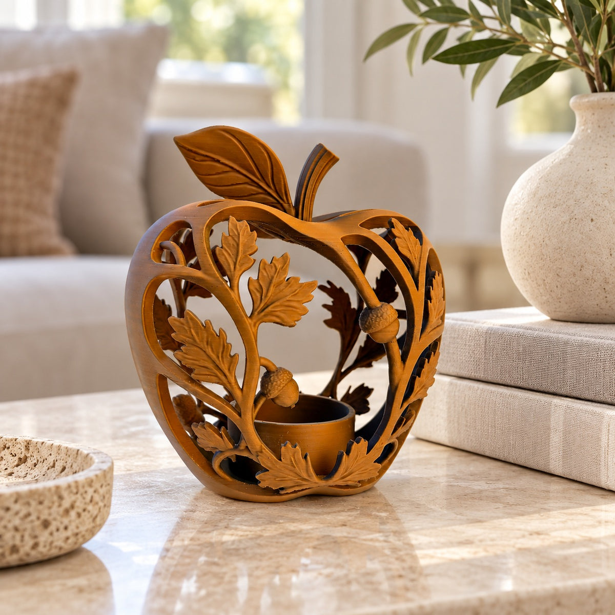 Green and brown Forest Fall tealight holders arranged together on an autumn table
