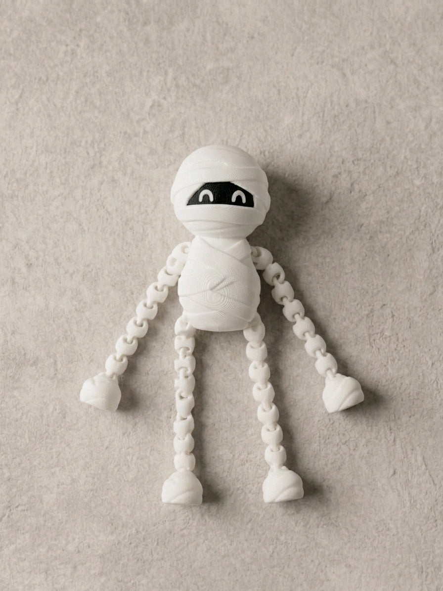 White wrapped skeleton fidget with long linked arms and legs