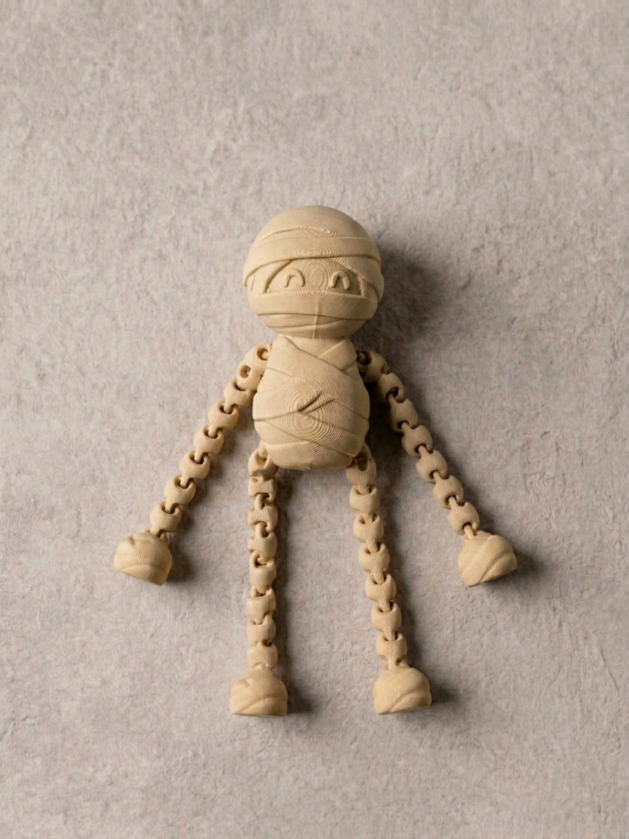 White skeleton fidget lying flat with sliding arms extended through the body