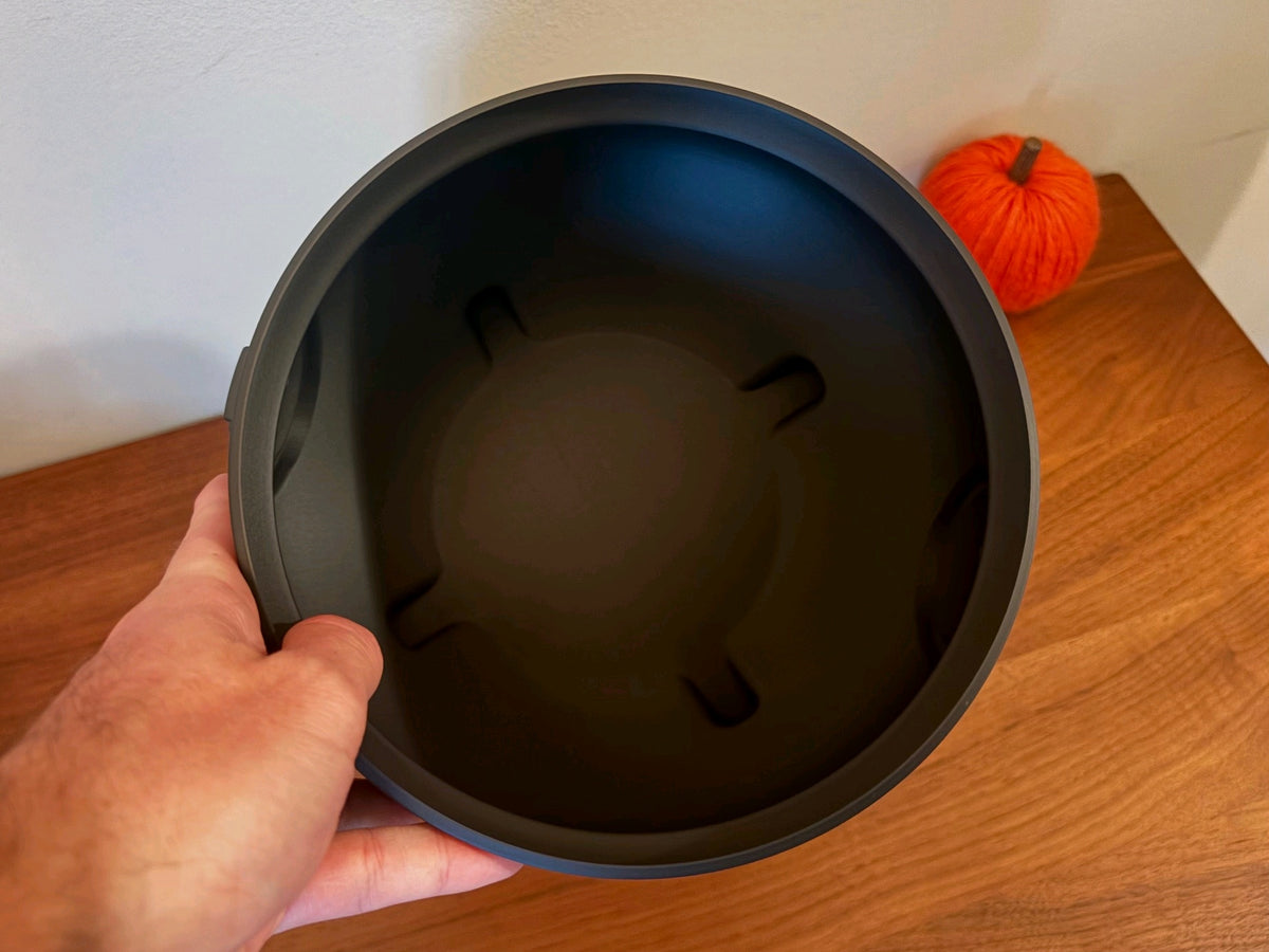 View into the open interior of the black cauldron tray