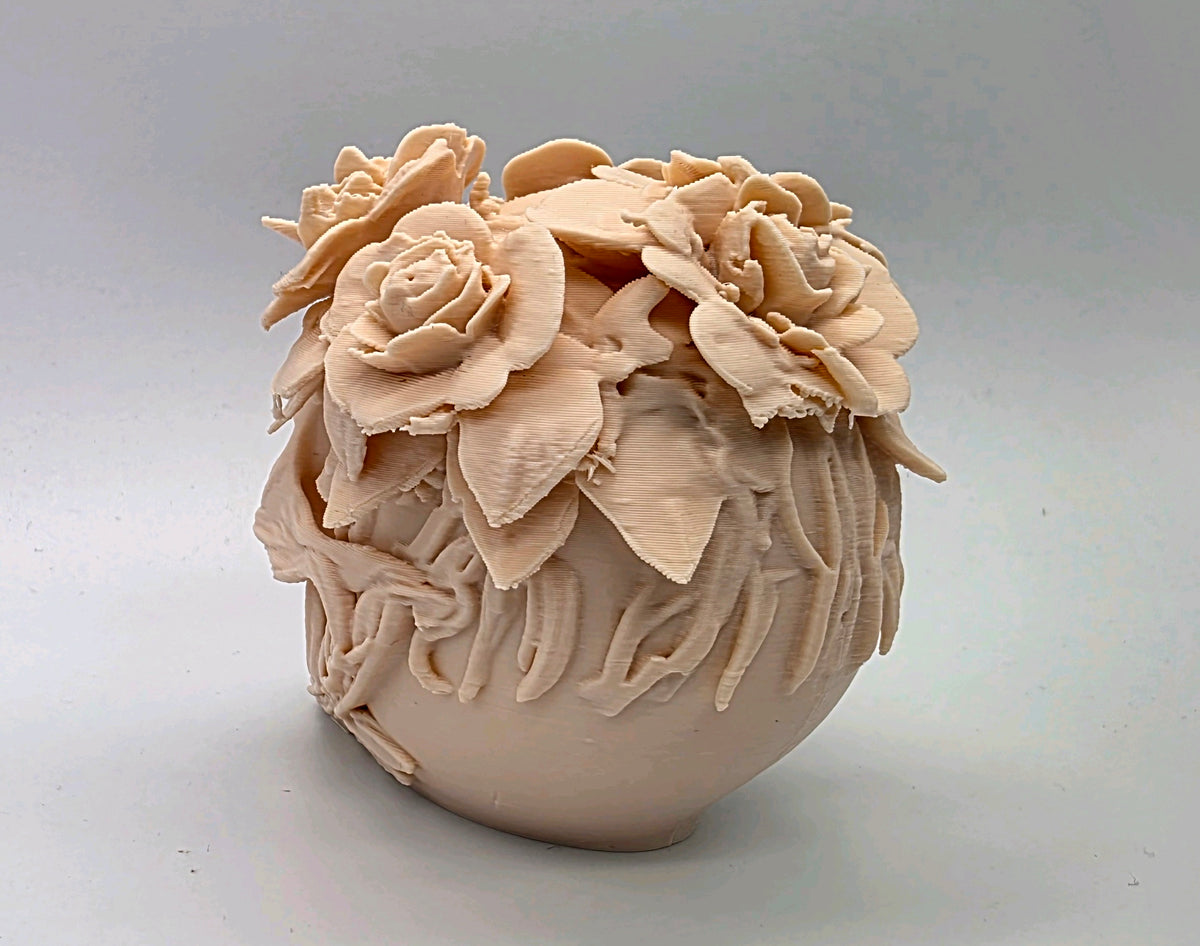 Rear view showing floral detail and foliage around the skull
