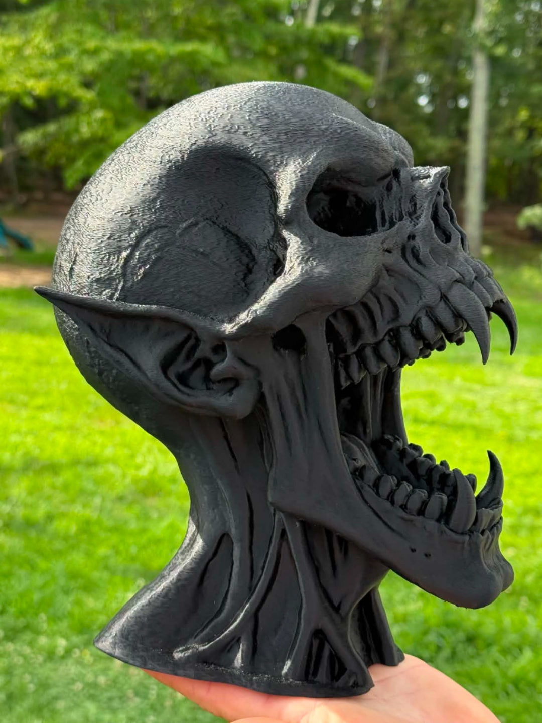 Black Vampire Skull bust with pointed ears, open jaw and long fangs