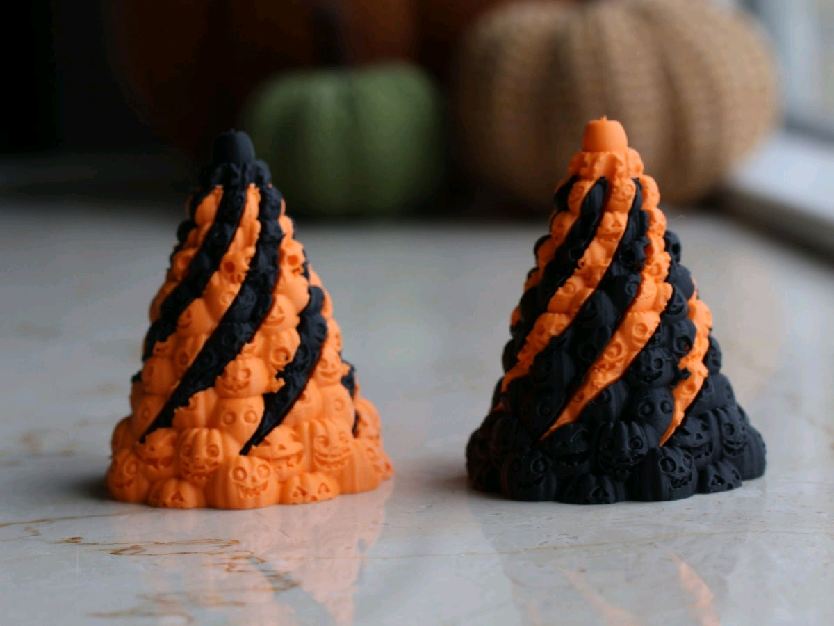 Orange and black Skull Mountain slide-through fidgets shown side by side