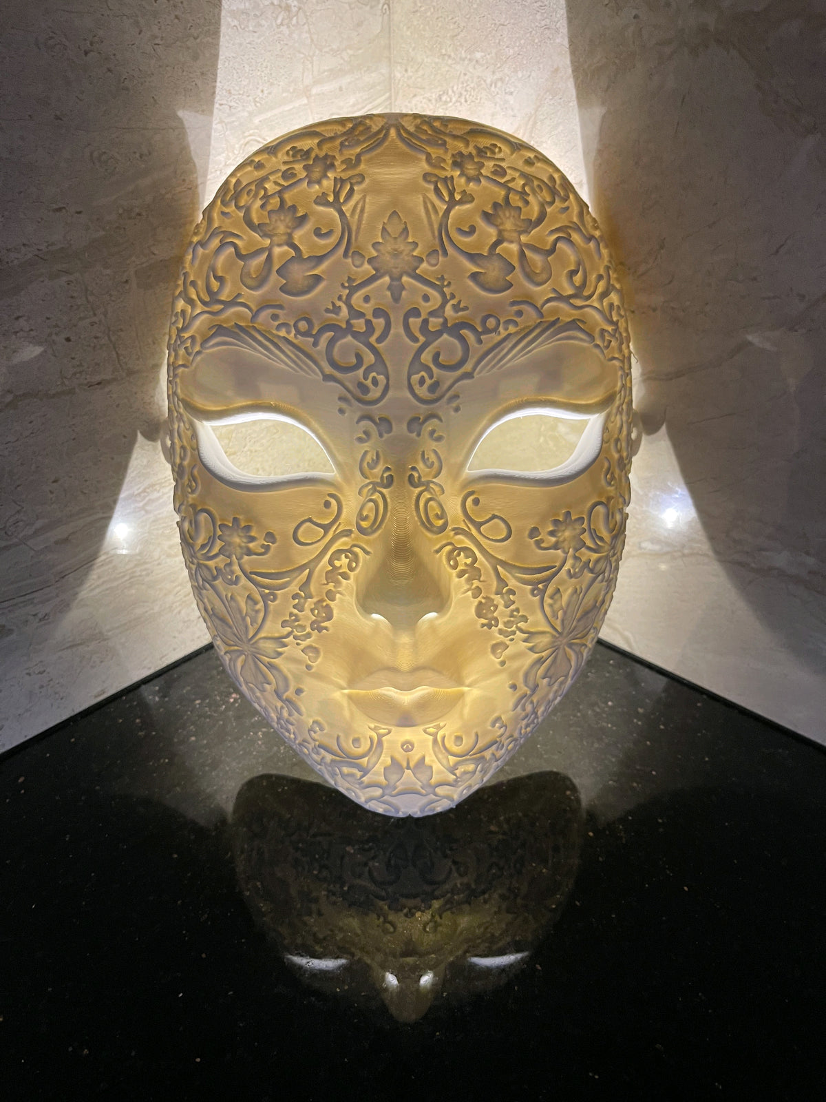Ornate white Halloween Love Mask displayed with warm backlighting