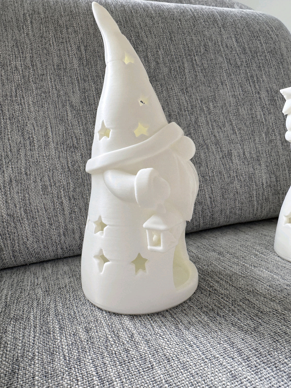 White tall-hat gnome tealight holder with star cutouts and a front opening