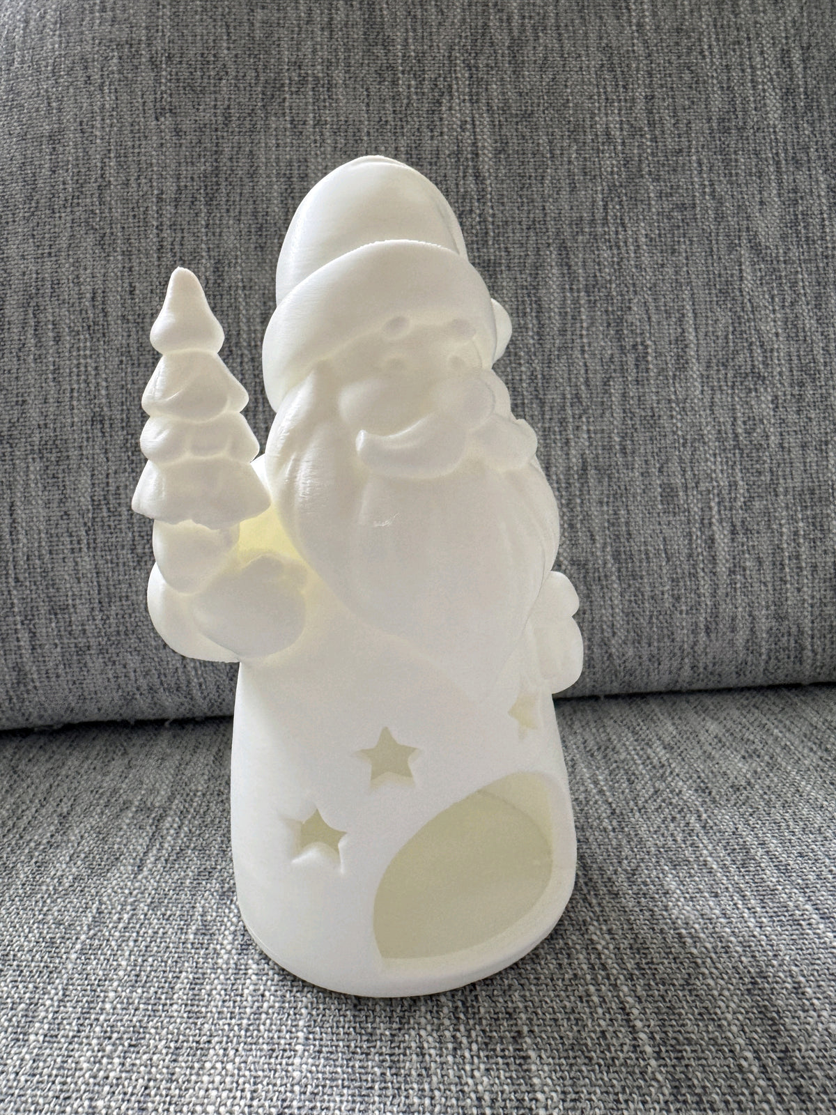 Alternate view of the blue Santa tealight holder with star details