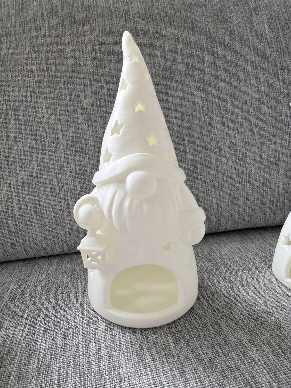 Three distinct Santa and gnome tealight holders shown together as a set