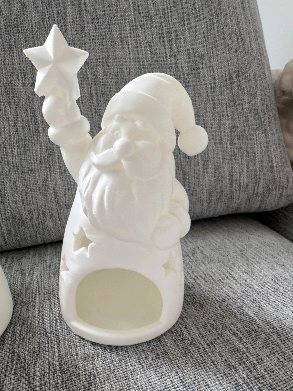 Close view of the Santa holder showing its star detail and tealight opening