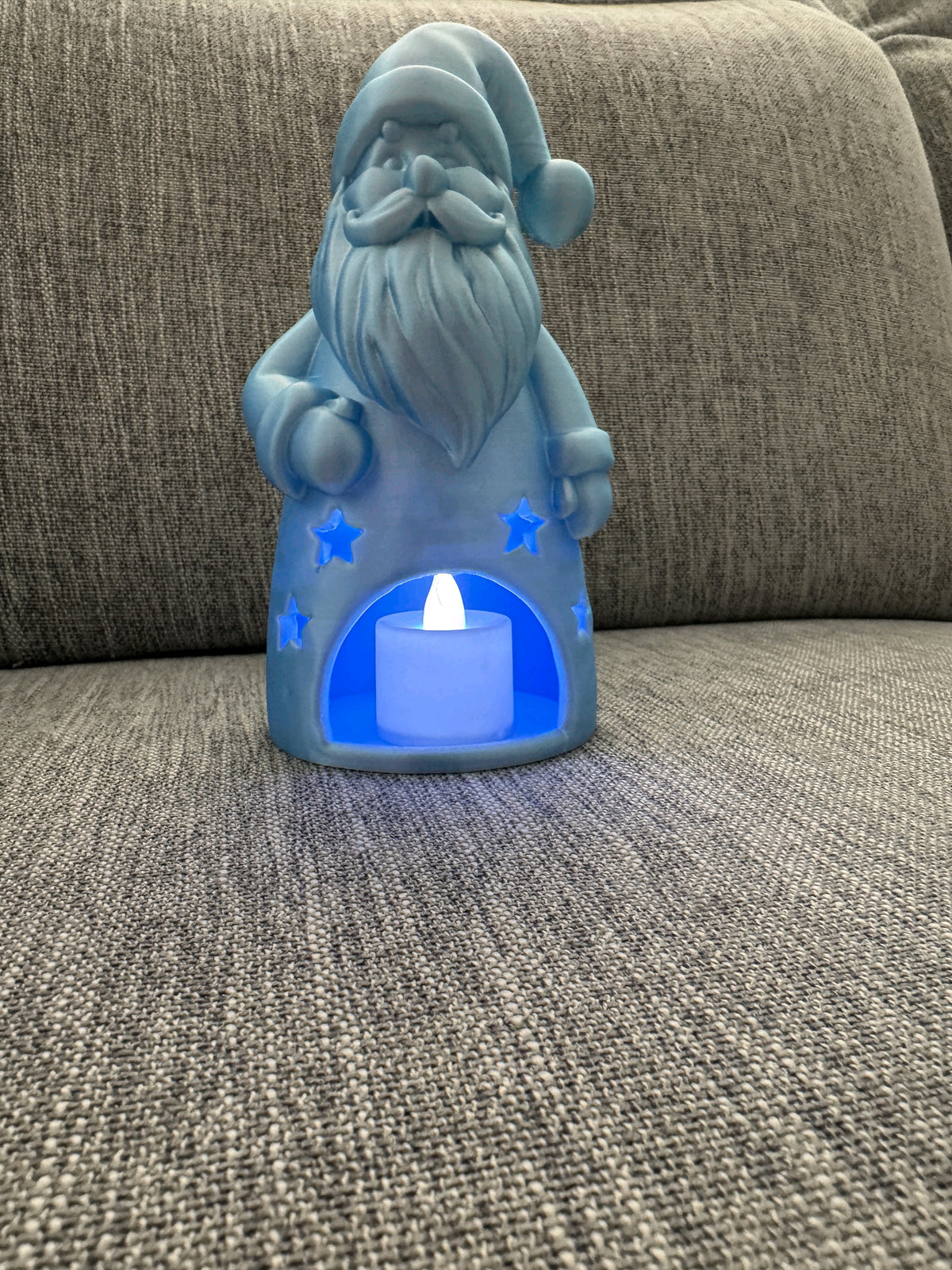 Side view of one of the Santa gnome tealight holders showing the front tealight opening