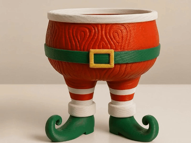 Santa legs sweet bowl filled with wrapped sweets and seasonal treats