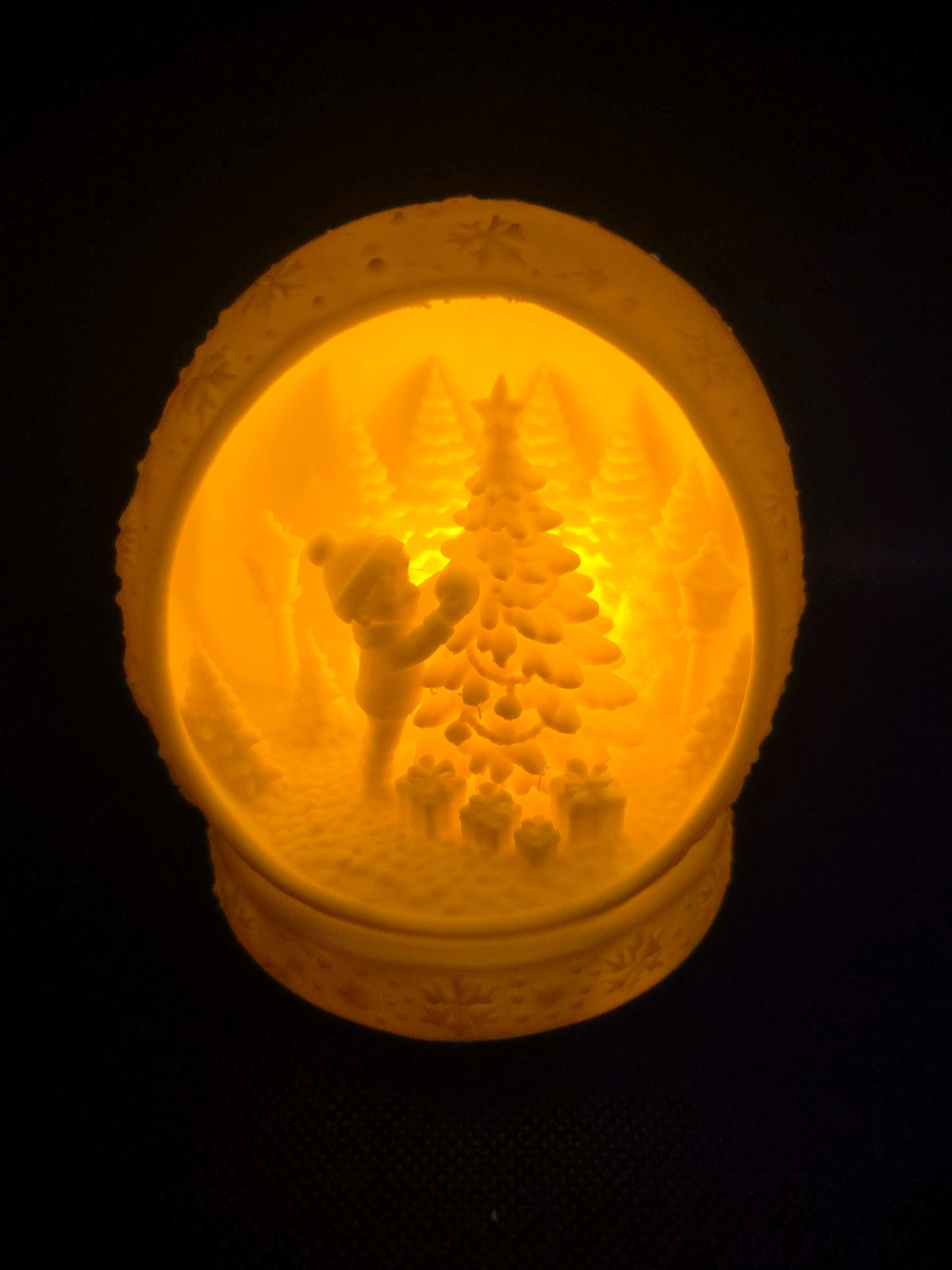 Open white Christmas scene tealight holder showing its miniature festive scene inside.