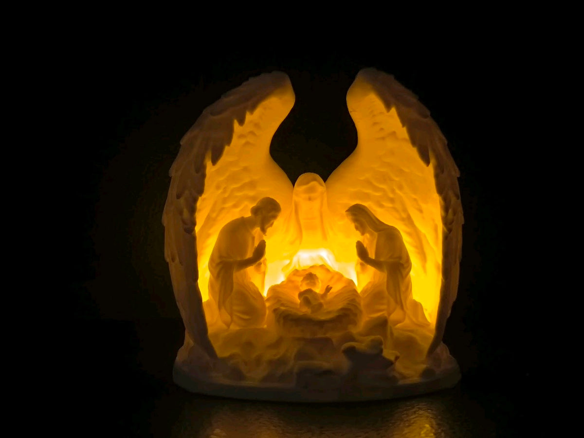 Illuminated angel-wing Nativity tealight holder