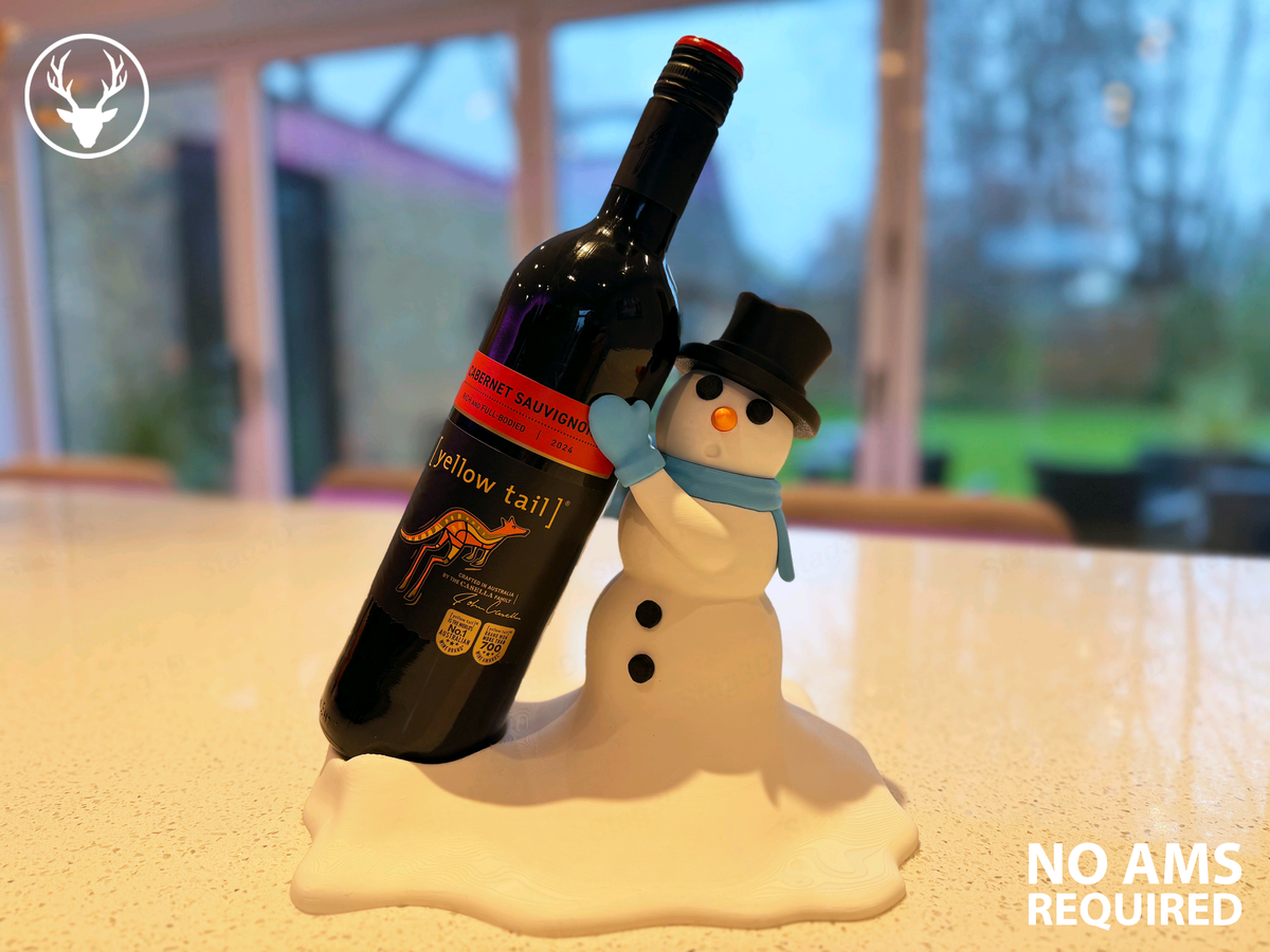 Snowman bottle holder displaying a bottle on a snowy base in a bright room