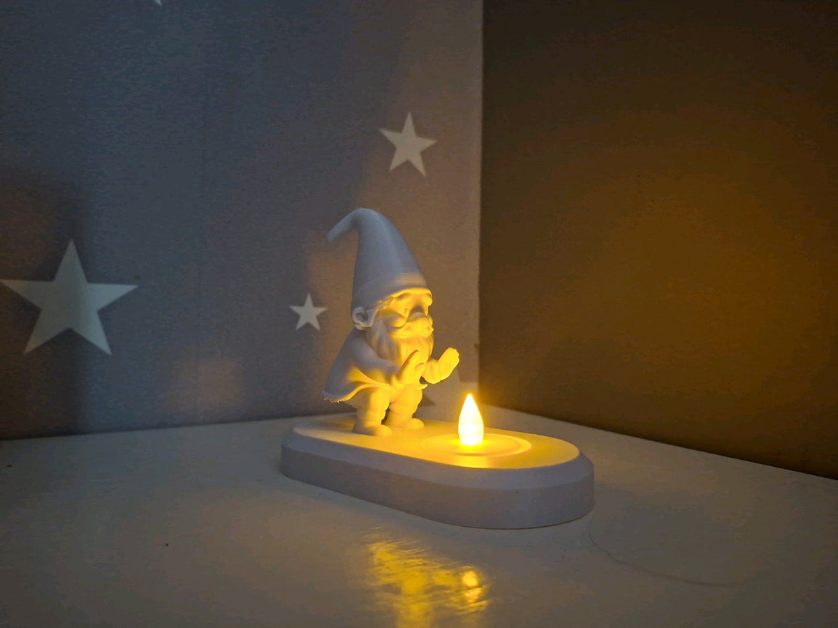 Close view of the bearded Santa figure and the LED tealight at the front of the base