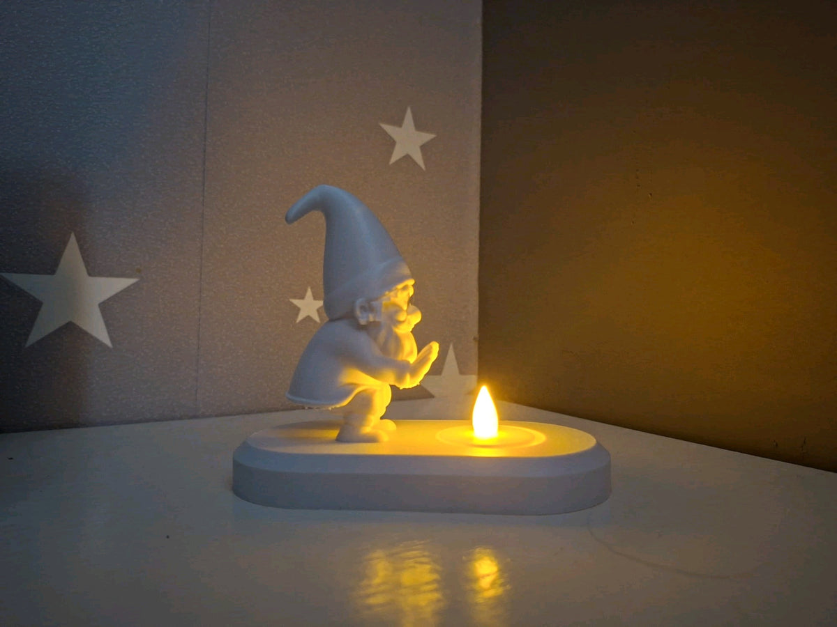 Angled view of the Santa over a tealight holder with warm LED illumination