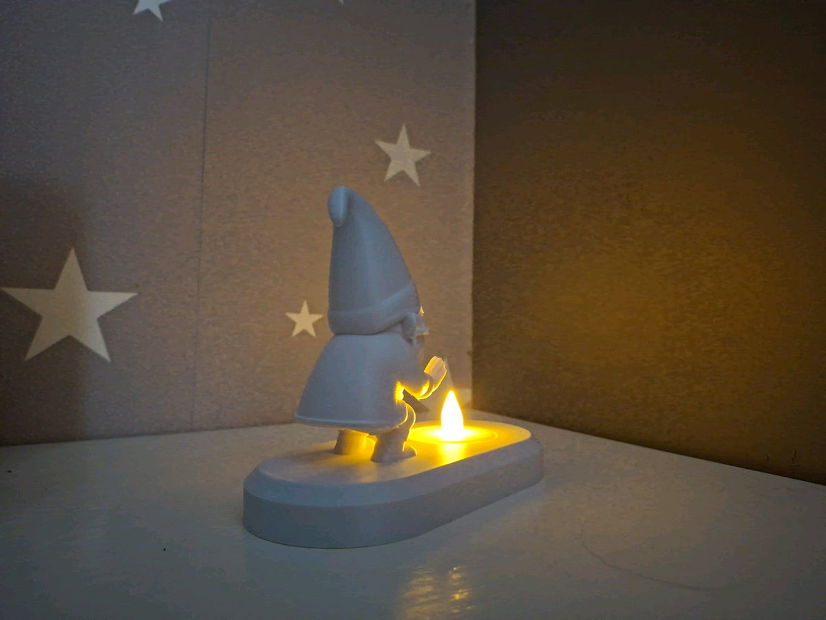 Santa figure on the oval tealight base viewed from the side