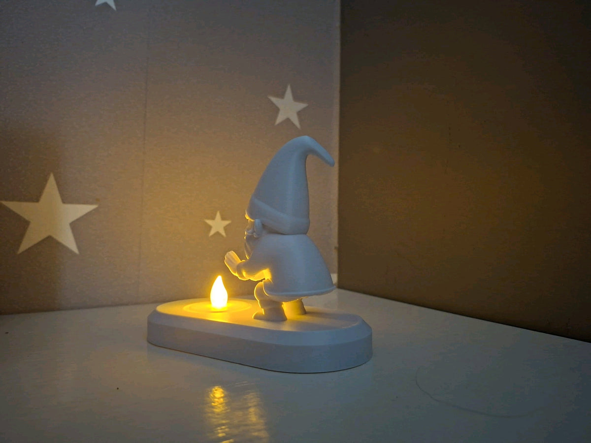 Rear angled view of the Santa tealight holder showing the figure standing behind the base