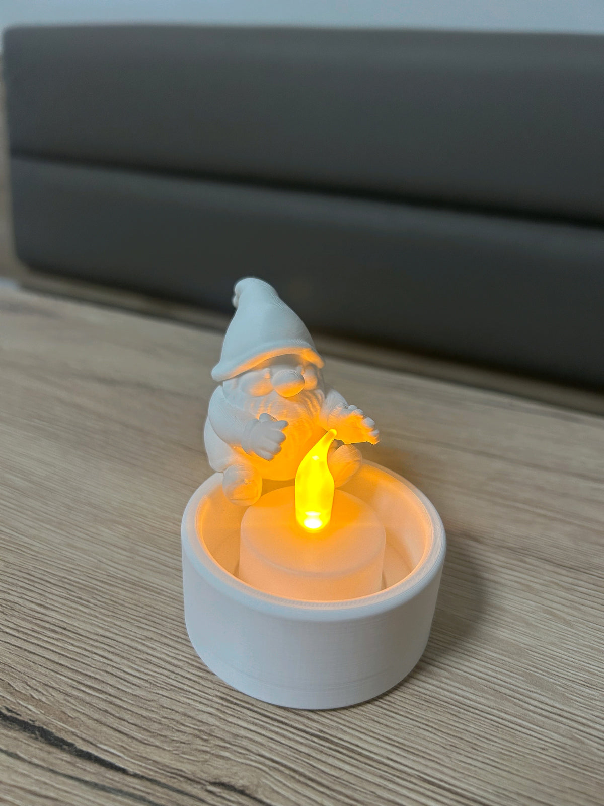 Alternate view of the small bearded Santa perched over the round tealight cup