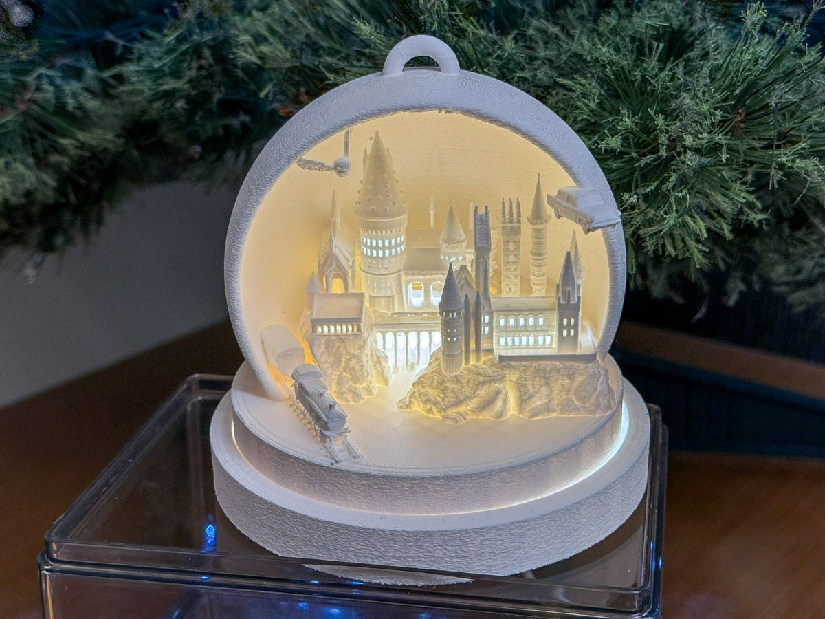 Full view of the glowing cathedral scene inside its rounded white frame