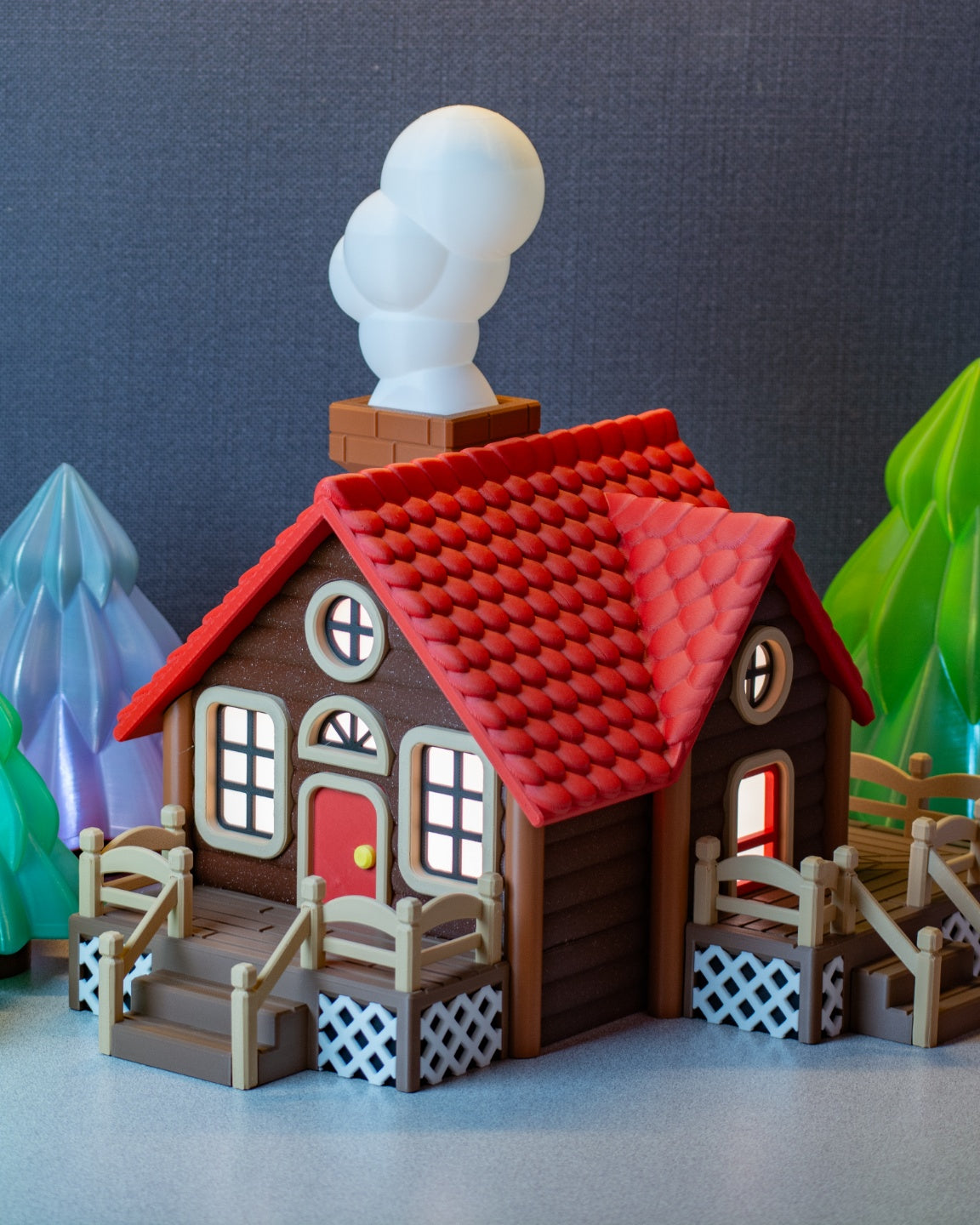 Cabin tealight holder with glowing windows and snowy woodland styling