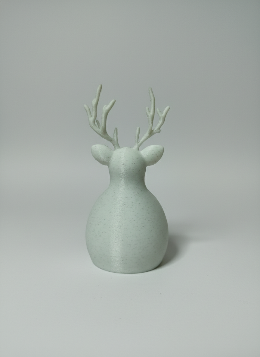 Rear view showing the smooth rounded back and antlers of the reindeer tealight holder