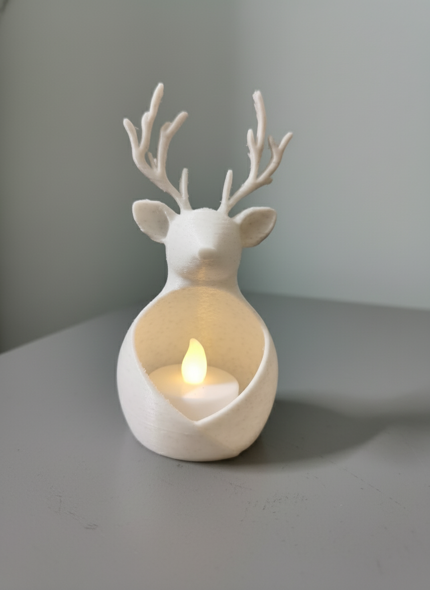 Pair of reindeer tealight holders with open front cavities, one shown with a flameless LED