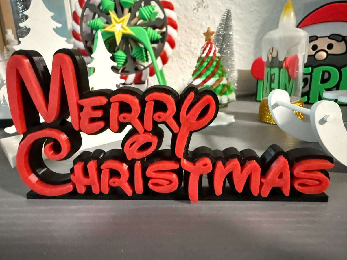 Red Merry Christmas lettering on the black background and base of the freestanding sign