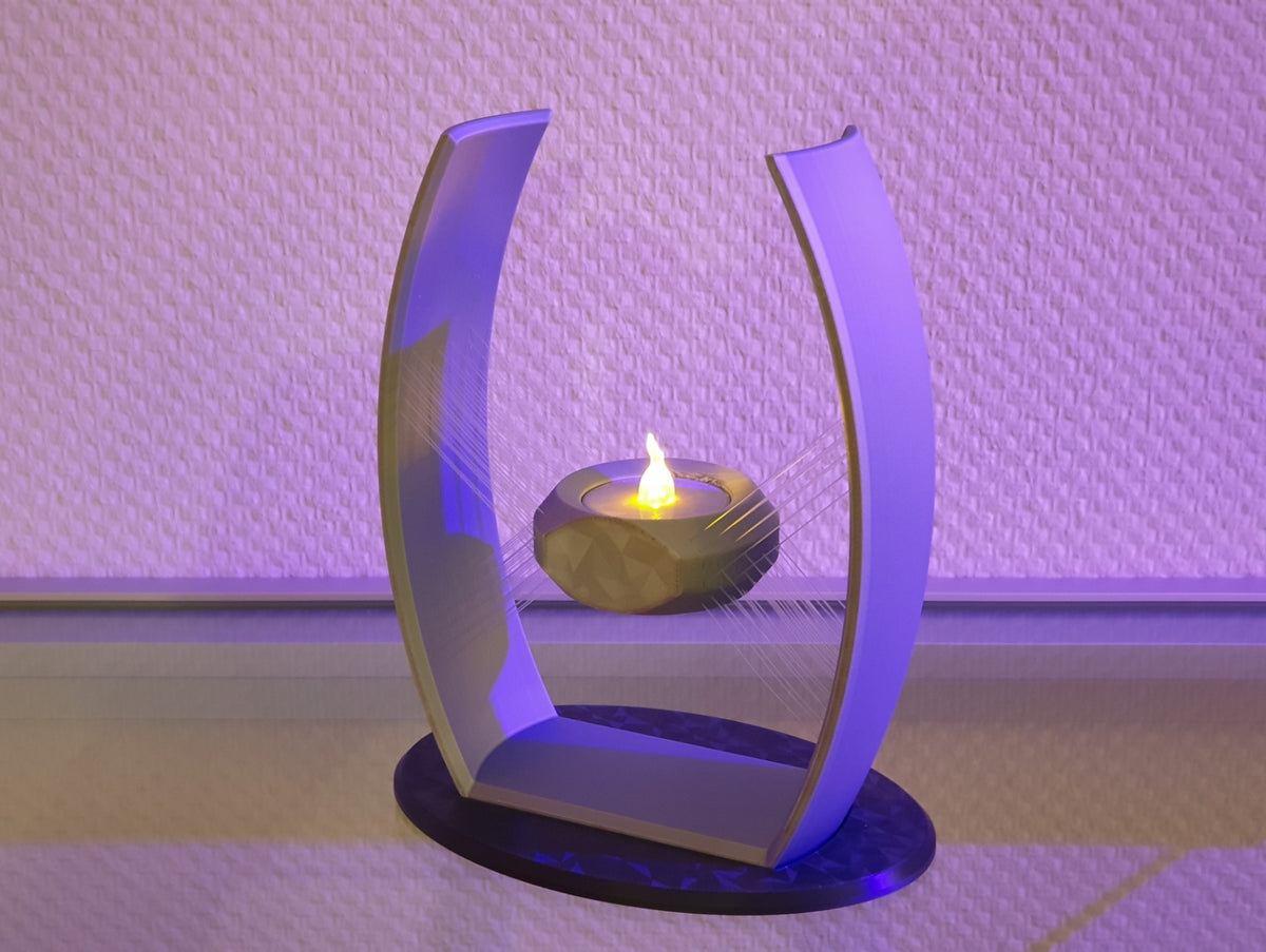 Grey suspended tealight holder with curved frame and black circular base