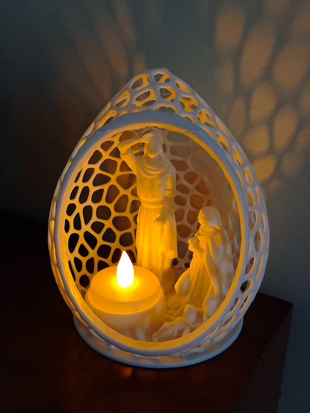 White oval openwork Nativity tealight scene with Mary, Joseph and baby Jesus