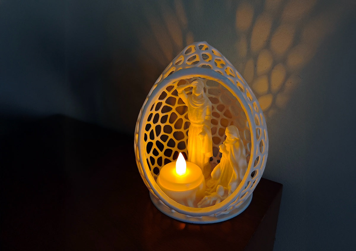 Angled view of the oval lattice Nativity tealight scene