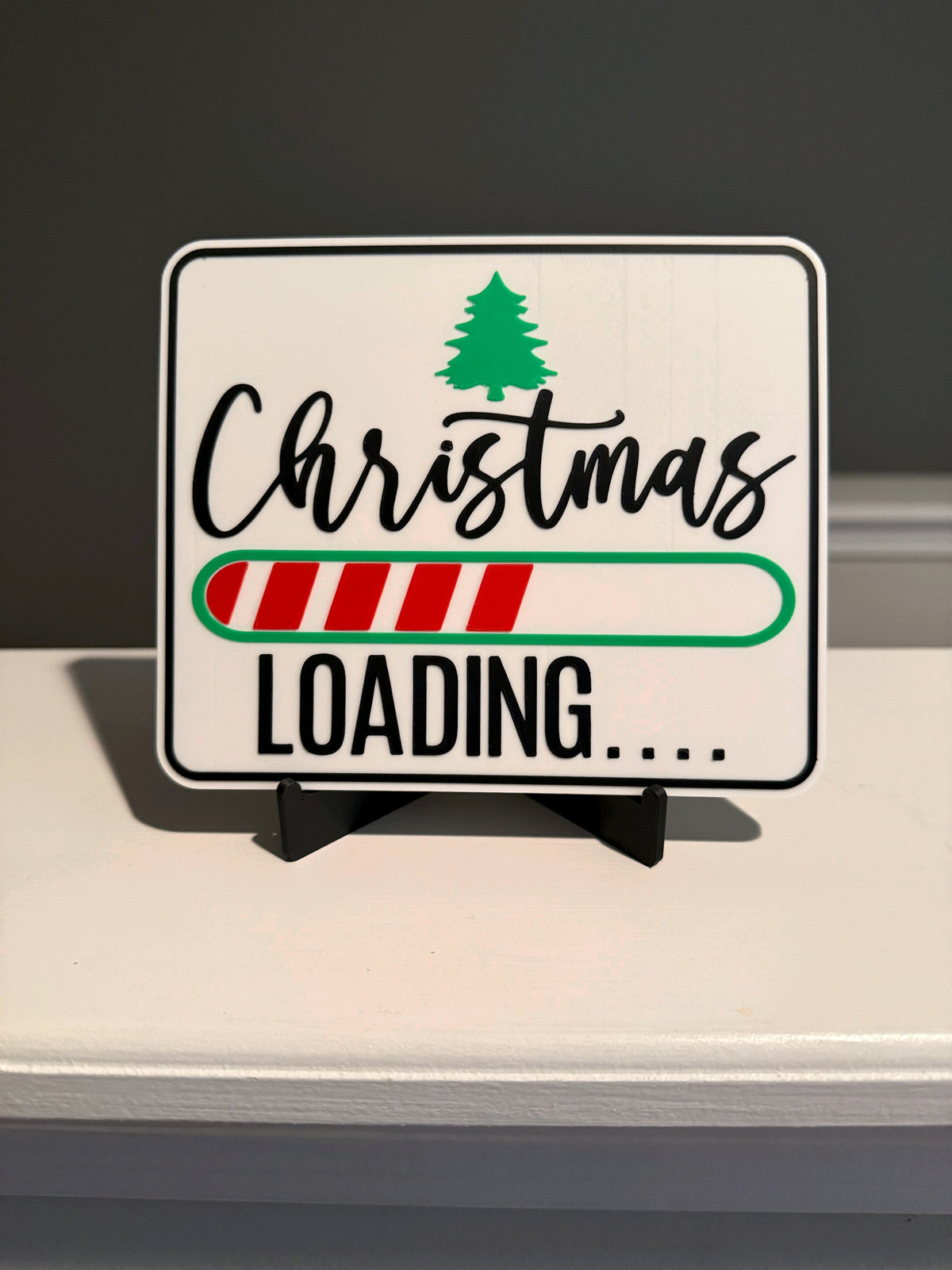 Close view of the Christmas Loading sign artwork and striped progress bar