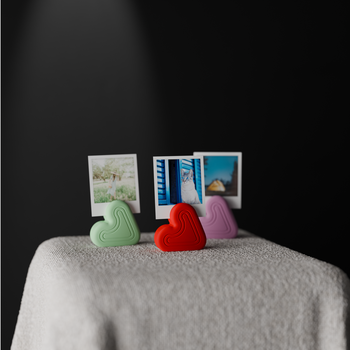 Heart Photo Holder Stand green red purple close up macro front shot dark dramatic background polaroid photos linen table