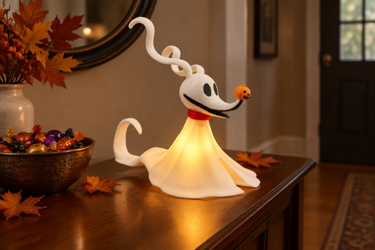 White ghost dog tealight holder with red collar and pumpkin nose on a Halloween entry console
