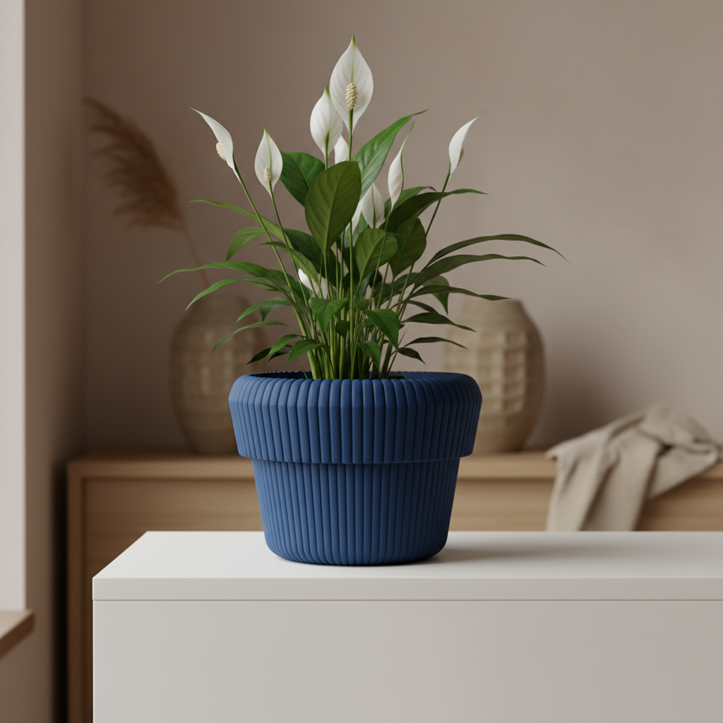Deep blue Venlo ribbed planter with a peace lily on a minimalist Japandi shelf