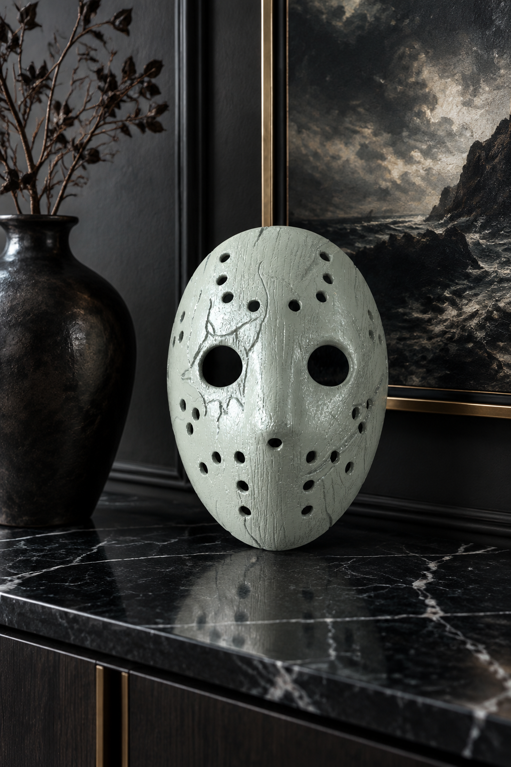 Pale weathered Jason Mask on a black marble sideboard