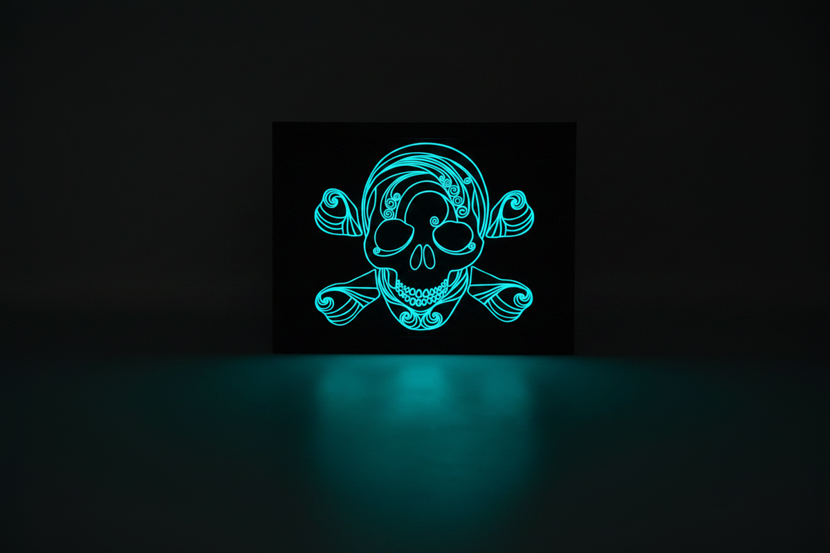 Spooky Swirls Glow-in-the-Dark Skull and Bones shadow box in a dark room glowing vivid cyan-turquoise and casting an eerie pool of light beneath