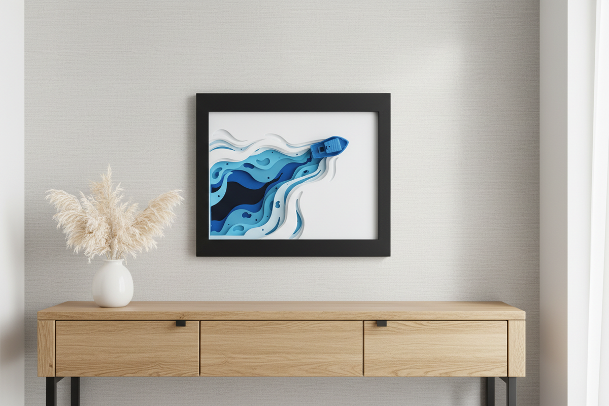 Ocean Voyage Shadow Box hung on a grey wall above a console table with pampas grass